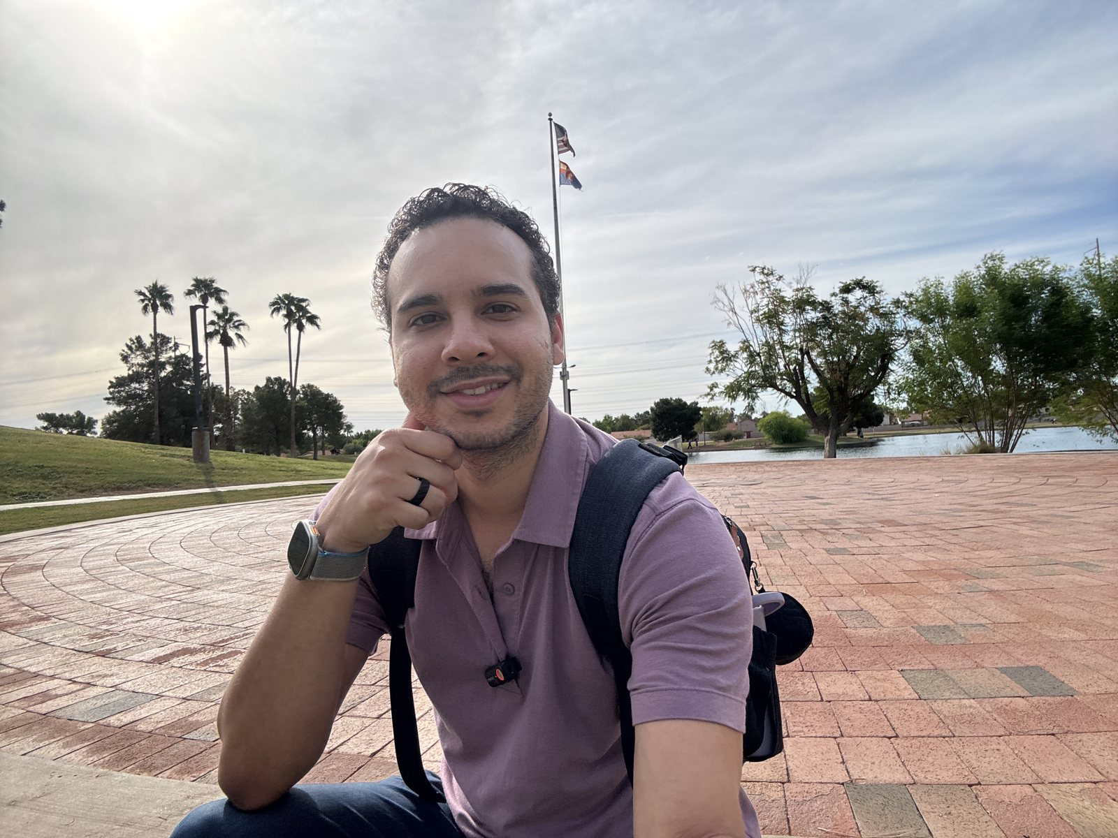 CJ Garcia, founder of AscendedGrowth, at a lakeside park in Arizona's East Valley